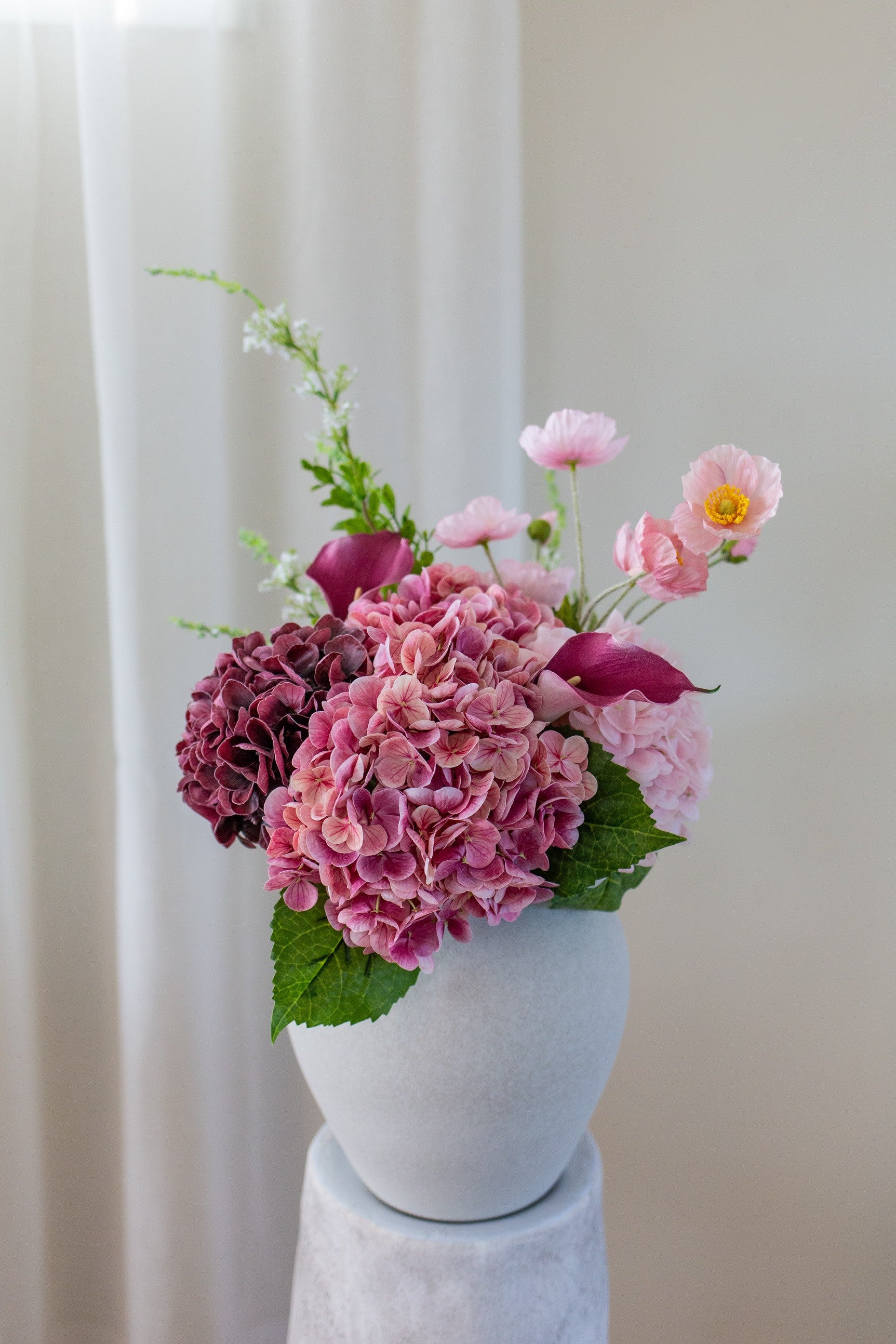 Kunstig blomsterbukett Lyng i vase med rosa og lilla kunstige blomster